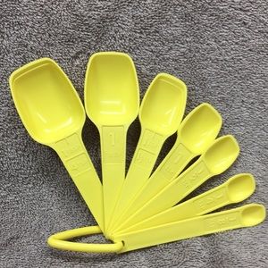Vintage Tupperware measuring spoons nesting yellow